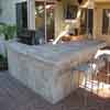 Outdoor living area and BBQ with travertine pavers